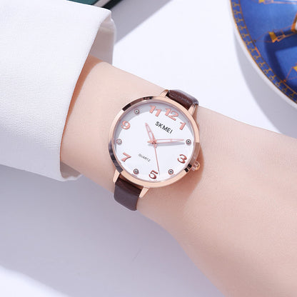 Elegant Analog Quartz Timepiece for women with Crystal Accents and Textured Strap